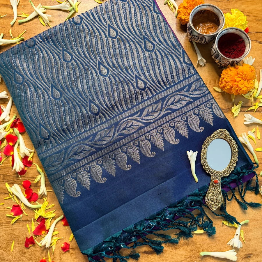Mayilvizhi | Peacock hues, woven with a contemporary rhythm.